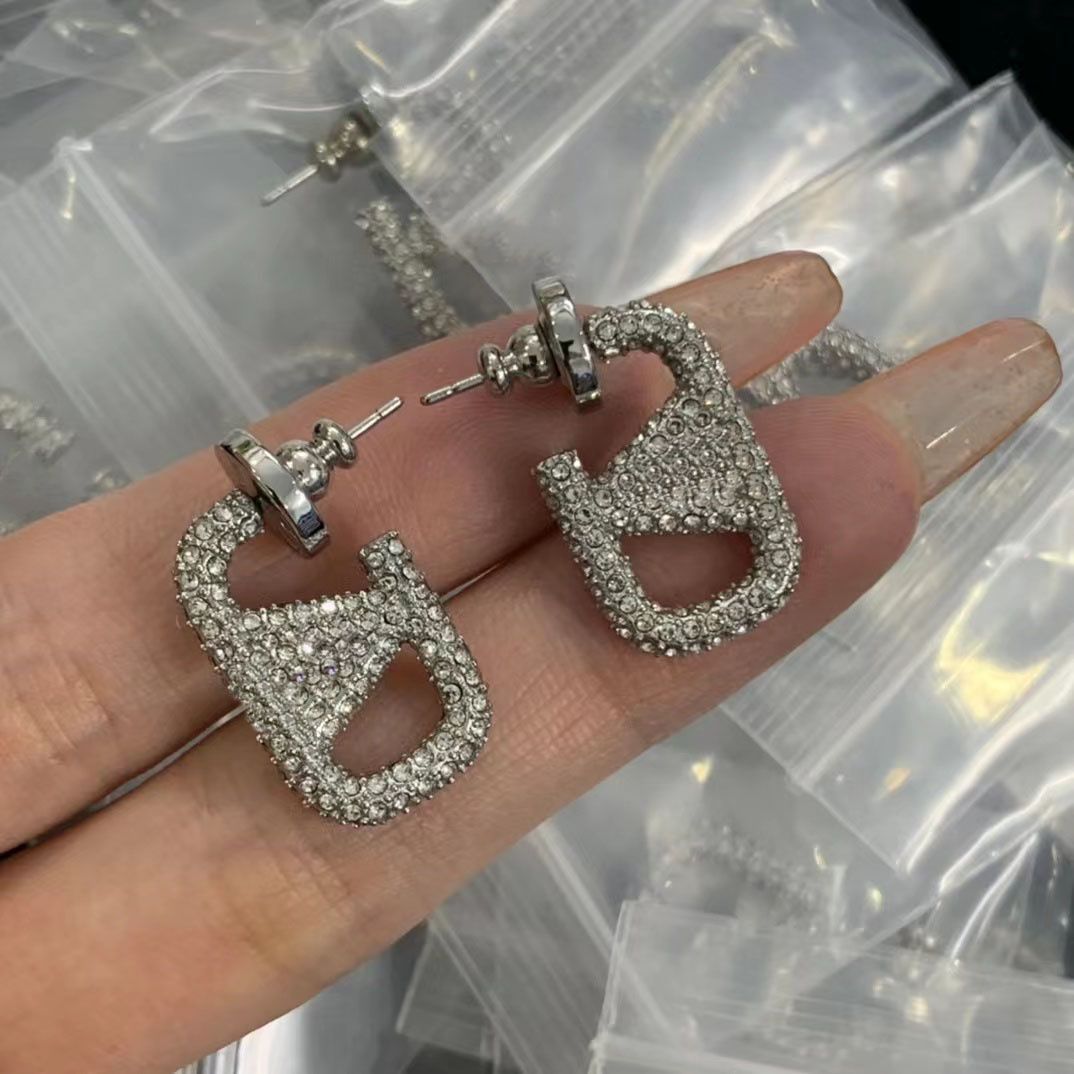 small silver earrings +box