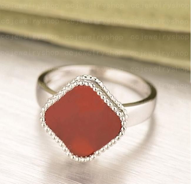 anillo de mujer rojo plata