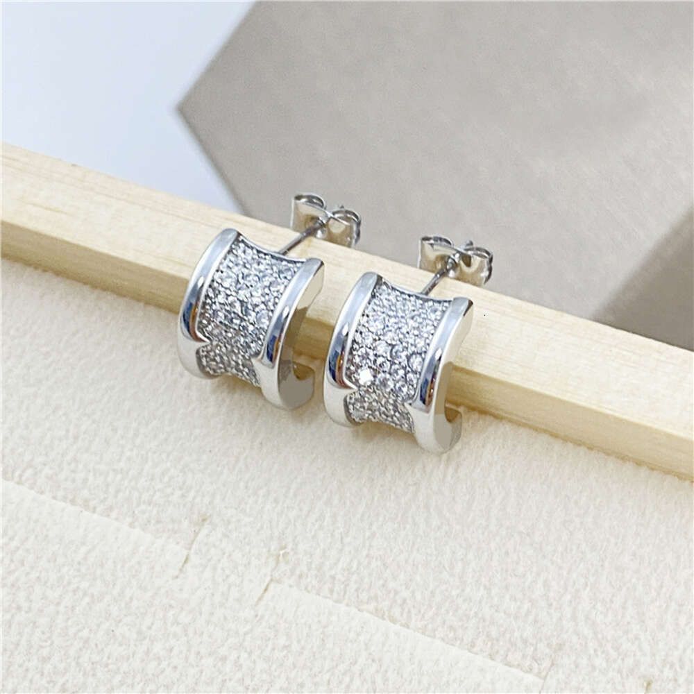 Baojia Small Waist Earrings. Silver