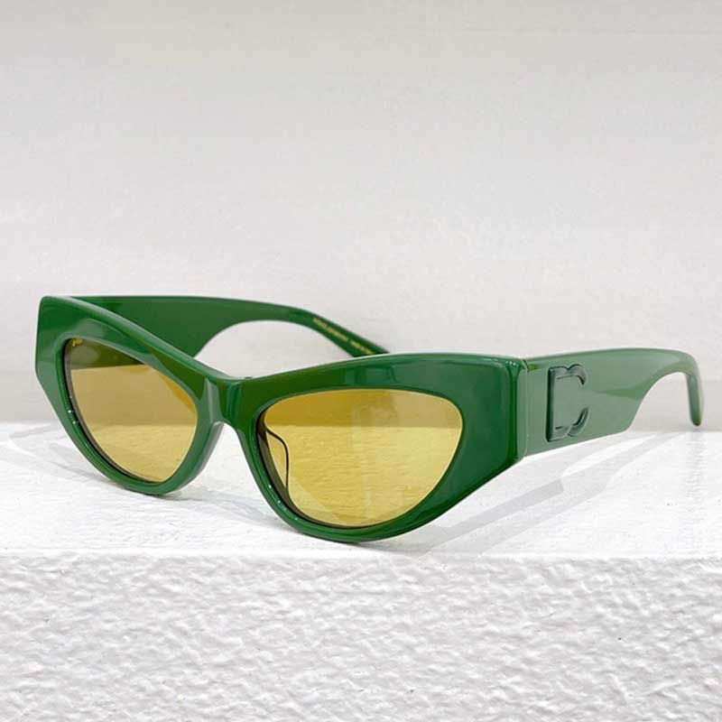 Green framed yellow lenses