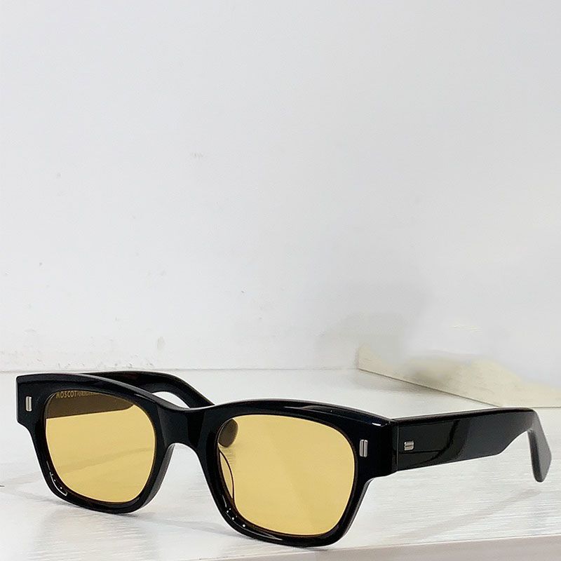 Black frame with yellow lenses