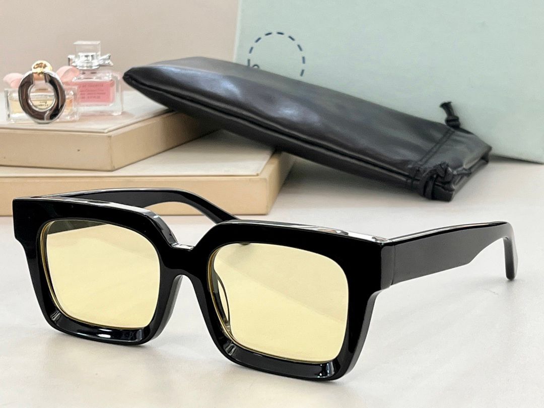 black frame yellow lens