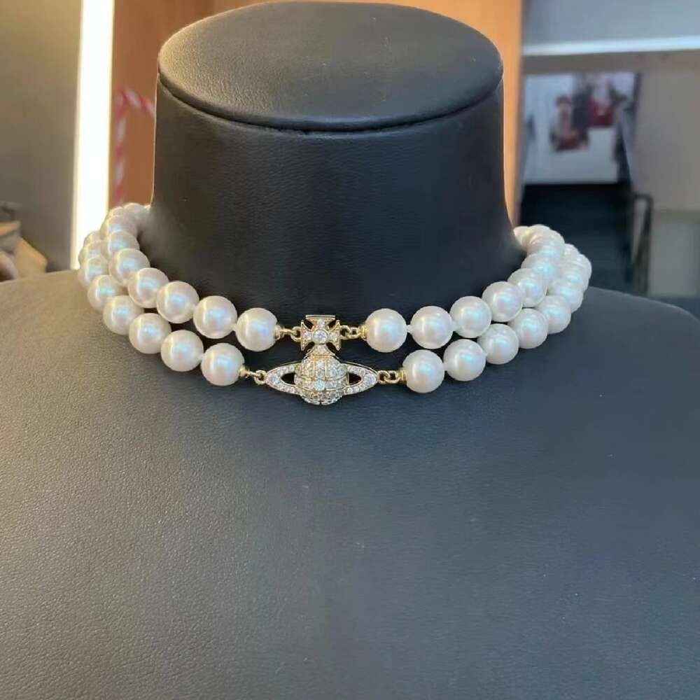 Collana con perle dorate Saturno a doppio strato