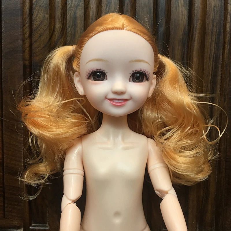 Bambola arancione-nuda
