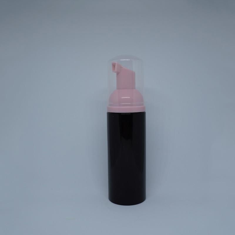 Zwarte fles + roze pomp