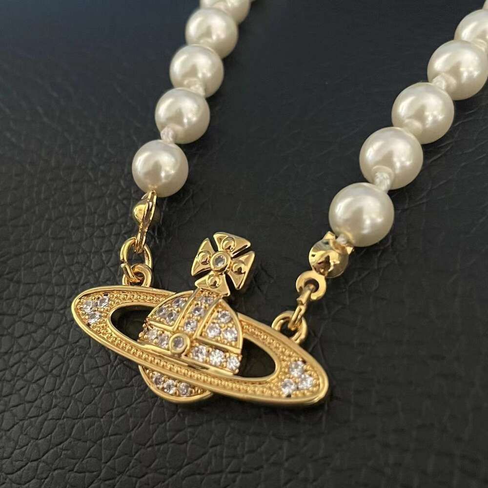 Pearl Saturn ketting goud