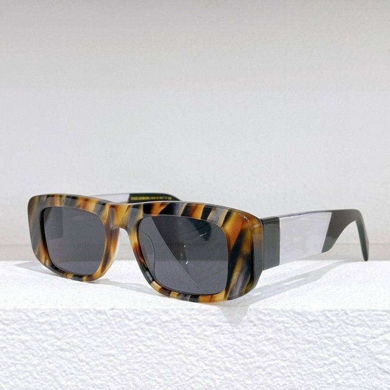 amber frame gradient gray lens