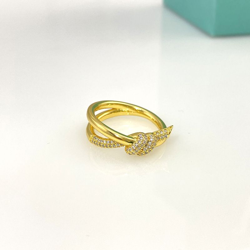 double knot gold ring with diamond