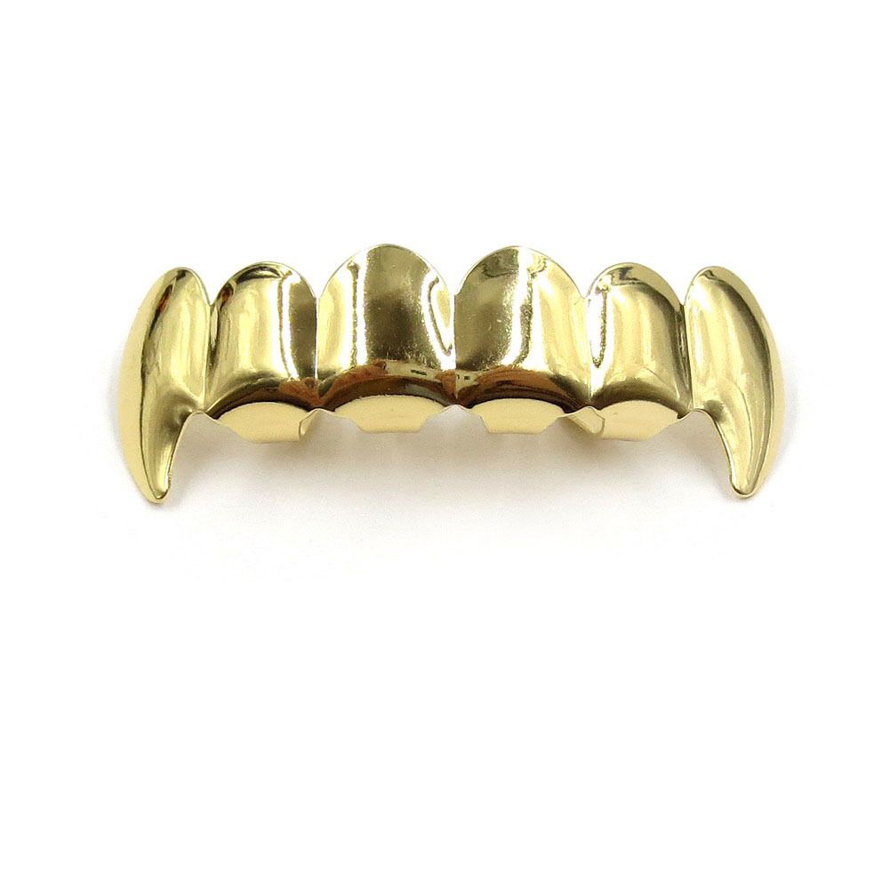 Gold fangs upper teeth