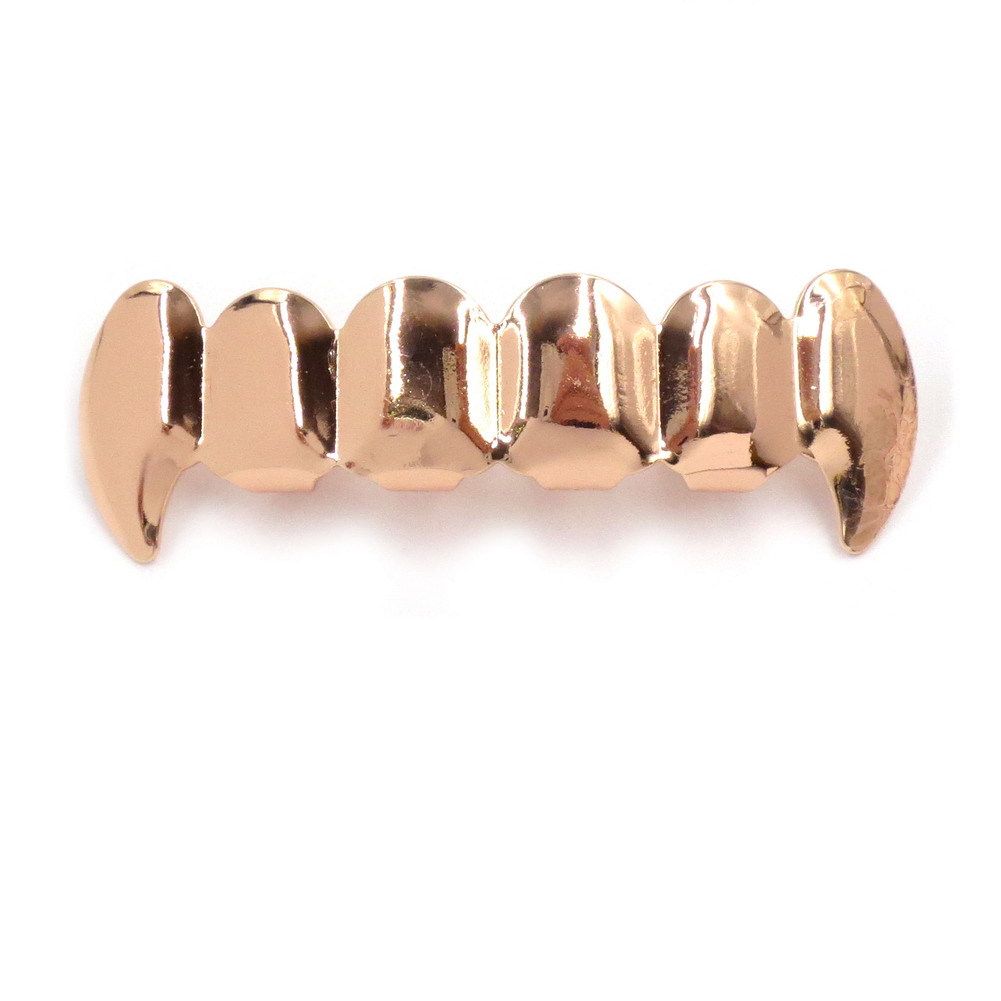 Rose gold fangs upper teeth