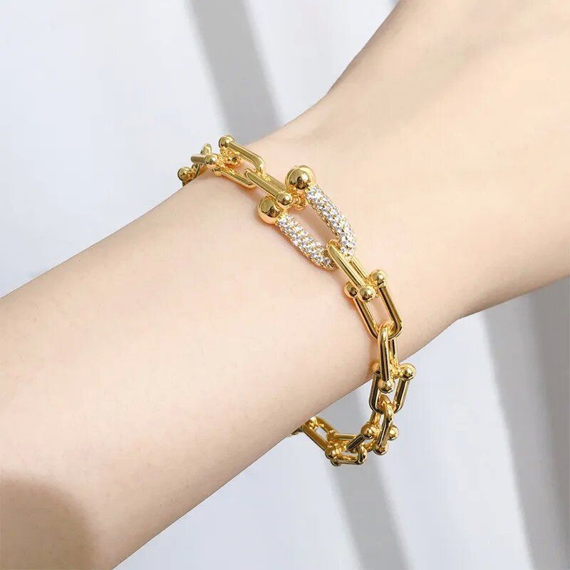 Gold bracelet--with logo