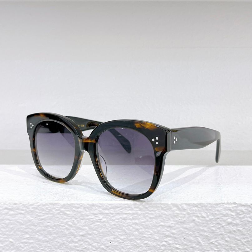 Amber frame Gradient grey lens