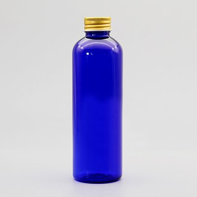 Złota plastikowa niebieska butelka