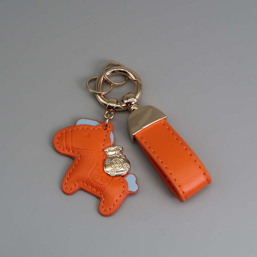 Oranje+sleutelhanger+goud