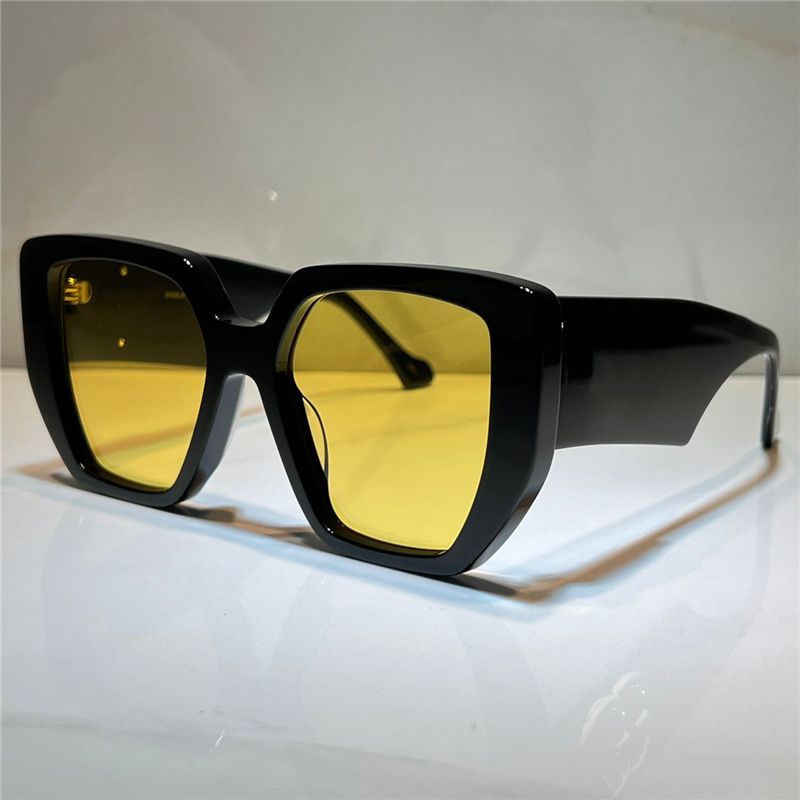 black frame yellow lens