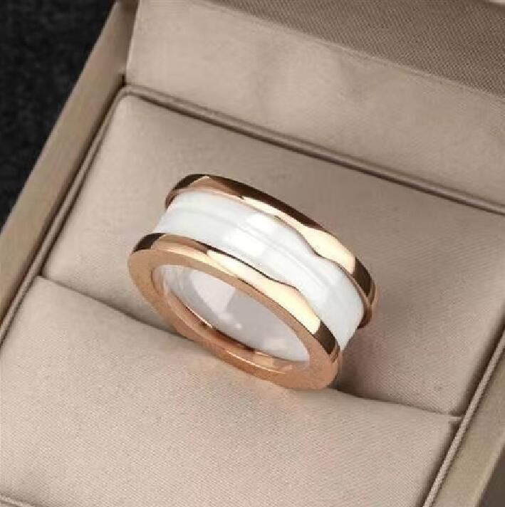 Двойное кольцо розового золота белая керамика