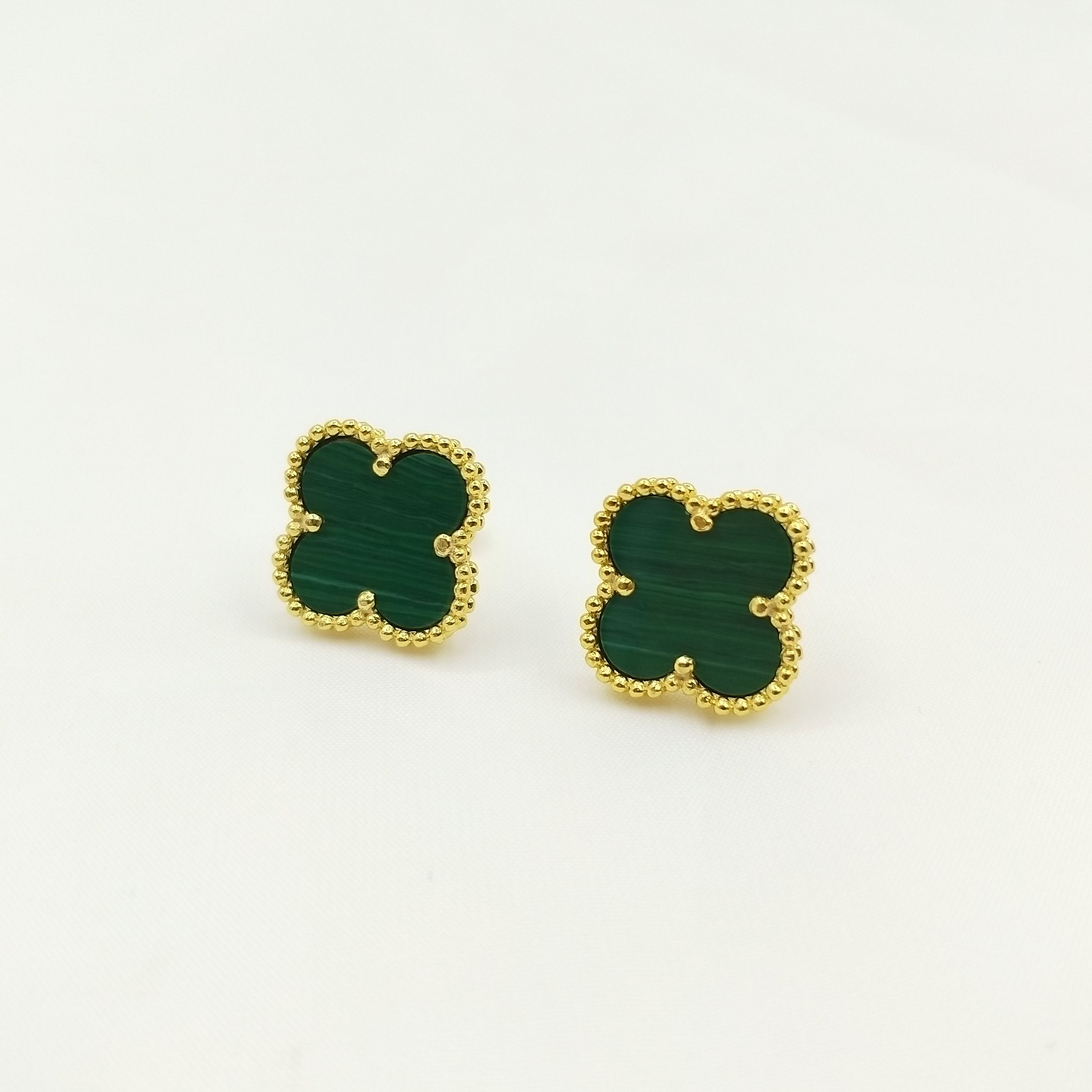 Gold earrings green