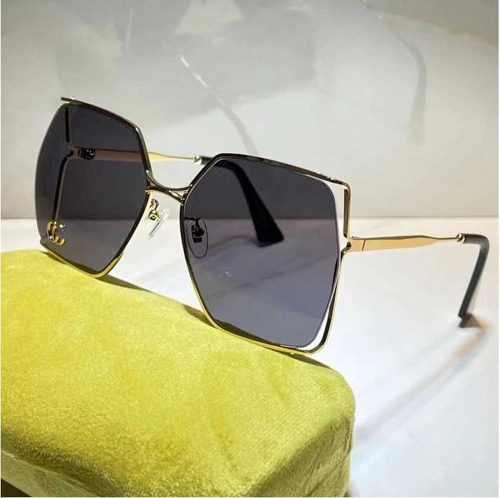 gold dark grey lens with letter