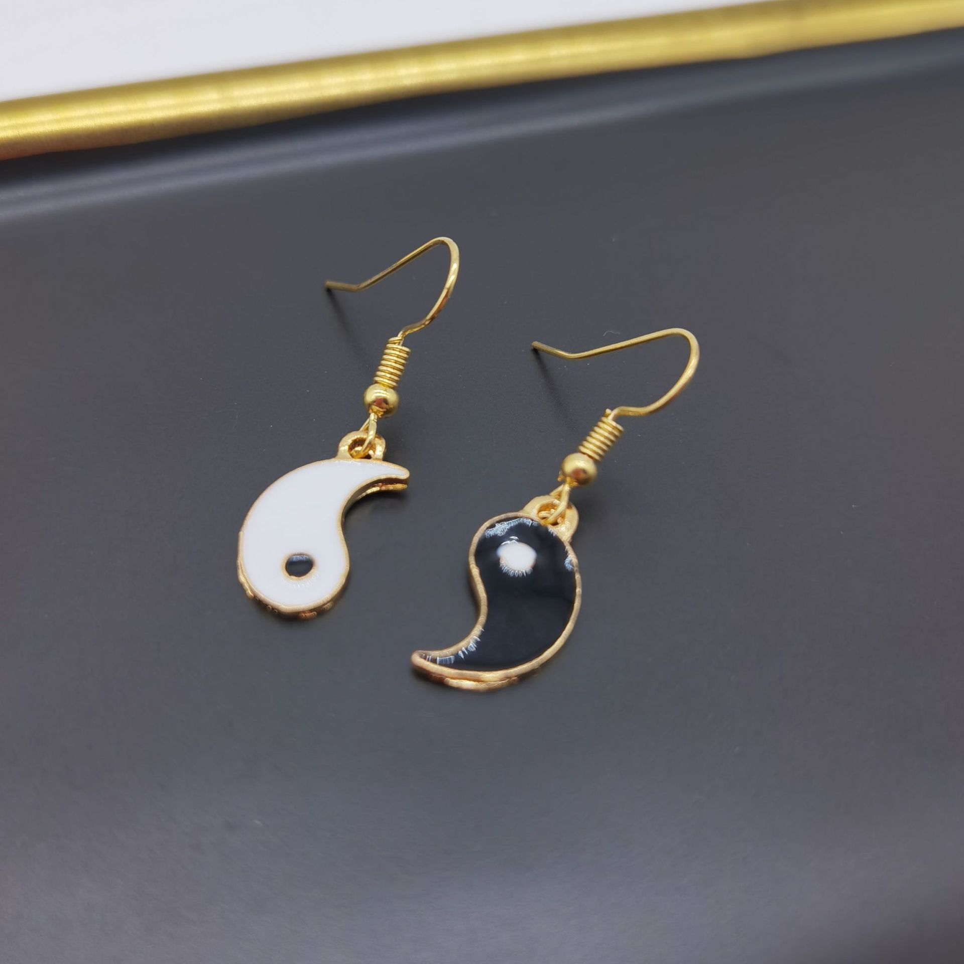 ② Gold pair of ear hook