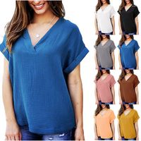 Camisetas de mujeres 2023 Cross europeas y americanas Camisa en V de alerta en V de manga corta Camisa suelta Color sólido Mujer ropa de verano