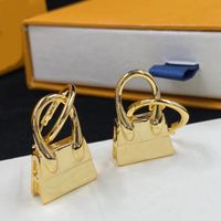 Los ￺ltimos aretes de encanto. Dise￱ador de aretes de lujo de forma de bolsas de bolsas de oro de 18K para mujeres. Fiesta de bodas Joyas de regalos de alta calidad