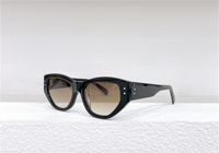 Роскошные женские дизайнерские солнцезащитные очки для женщин женская ретро -эстетическая мода эстетические солнцезащитные очки для мужчин кошачий глаз UV400 защищать линзы.
