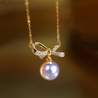 Подвесные ожерелья Bowknot жемчужный подвесной женский ожерелье Свет роскошное меньшинство Высокое смысл ключица.