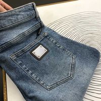 Высококачественные мужские джинсы DG -дизайнерские брюки металлические брюки для брюки. Мужчина повседневная пуговица на молнии повседневные джинсы
