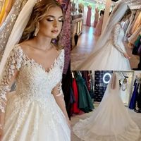 Luxueuse robes de mariée en dentelle perlée arabe Dubaï Appliques à manches longues vintage Sequins de roches de mariée