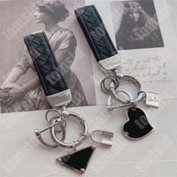 Keechchains Designer di moda per le donne tastiera per auto tastiera marca di cuoio nero catene in pelle inossidabile sacchetto in acciaio a sospensione di lusso di lusso