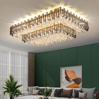 The new  modern crystal chandelier illumines the living room...