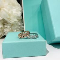 Luxurys diseñadores de moda t-grid anillo de diamantes clásico anillos huecos anillos esenciales para hombres dorado y plata 2 colores