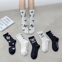 Femmes chaussettes noires blancs coton papillon imprime