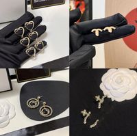 Kadınlar İnci Saplama Küpe Tasarımcıları Pirinç Mücevher Elmas Love Ear Studs Bakır Lüks Hoops Moda Altın 925 Gümüş Aşk Küpe