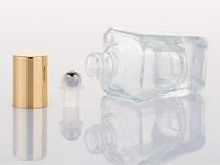 Botellas de aceite esencial de vidrio de moda Bottalas Aromaterapia Perfumes Bálsamos labiales Roll en botellas con gorra de plata dorada 15 ml