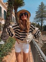 Sweaters de mujeres tejidos blancos con un estilo de calle dulce y elegante elegante estilo sétero cómodo y suelto de otoño