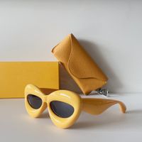 Gelbe graue Katzenaugen-Sonnenbrille, dicker Rahmen, lustiger Stil, für Damen und Herren, Sommer-Sonnenbrillen, UV400-Brillen mit Box