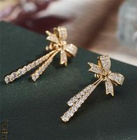 Aimgal Jewelry 3ex Zirkon 18k Gold plattiert Bowknot Quaste Lastel 925 Silbernadelohrringe Frauen
