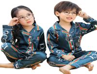 Детская дизайнерская одежда Новая младенца пижама набор лето имитированная шелковая ткань с коротким рукавами.