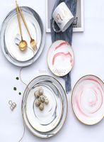 Piatti piastra piatto dorato in marmo e imposta piatto in ceramica nordica dessert di frutta domestica occidentale