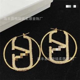 22% OFF Large circular hollow large V-letter diamond inlaid two Colour Huajia brass material style Personalised street earrings