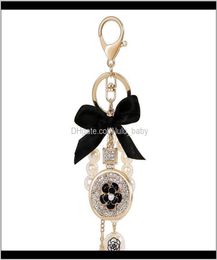 Lovely Cute Bow Pearl Flower Perfume Bottle Fashion Ins Luxury Designer Diamond Rhinestone Bag Charms Tassel 8Zlh6 Nen2Y8071553