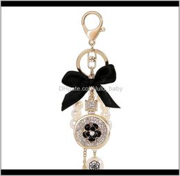 Lovely Cute Bow Pearl Flower Perfume Bottle Fashion Ins Luxury Designer Diamond Rhinestone Bag Charms Tassel 8Zlh6 Nen2Y9750410