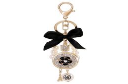 Lovely cute bow pearl flower perfume bottle keychains new fashion ins luxury designer diamond rhinestone bag charms keychains tass4850706