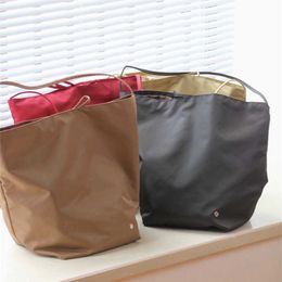 10AAAA High end The * Row Fashion Waterproof Nylon Cloth Large Capacity Tote Bag Casual Handheld Shoulder Bag Water Bucket Bag for Women 240105