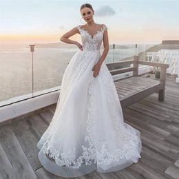 Stunningbride 2024 Abiti da sposa eleganti linea A Sheer Scoop Neck Cap Sleeve Abiti da sposa Bottoni in tulle Applicazioni di pizzo Abiti da sposa