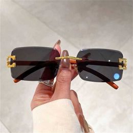 20% OFF Wholesale of New vintage frameless wood grain leopard head radiation proof Sunglasses for outdoor driving Korean version high appearance sunglasses