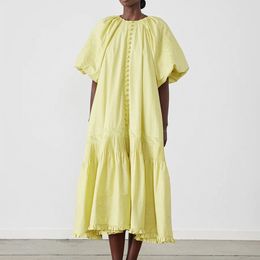 Australian designer dress with organic cotton embroidery, round neck, short sleeved lantern sleeves, waist tied, yellow vintage dress