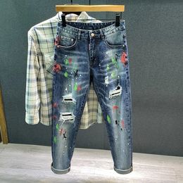 Men's Slim Jeans Spring Graffiti Ripped Hole Spray Paint Patch Hip-hop Fashion Denim Pants Male Streetwear 240108