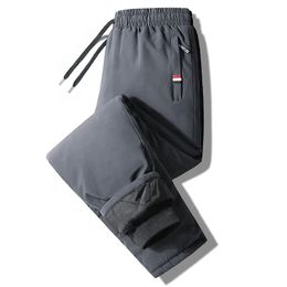 Autumn Pants Men's Elastic Waist Fitness Sportswear Winter Waterproof and Warm Large Sized Loose Down 7Xl 240109